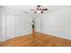 Bedroom with Hardwood floors, ceiling fan, and a large closet at 927 Boardman St, Orlando, FL 32804