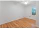 Bright bedroom with hardwood flooring and a window, offering a serene and inviting atmosphere at 927 Boardman St, Orlando, FL 32804