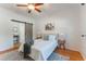 Comfortable bedroom featuring a barn door and a ceiling fan, offering a blend of modern farmhouse charm and comfort at 927 Boardman St, Orlando, FL 32804