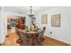 Inviting dining room with wicker chairs, decorative table setting, and open kitchen view at 927 Boardman St, Orlando, FL 32804