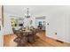 Cozy dining room with hardwood floors, modern chandelier, and stylish wicker chairs at 927 Boardman St, Orlando, FL 32804