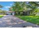 Attractive home featuring a brick driveway and well-maintained landscaping at 927 Boardman St, Orlando, FL 32804