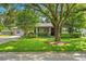 Charming single-story home featuring a well-maintained lawn and a mature shade tree in a quiet neighborhood at 927 Boardman St, Orlando, FL 32804
