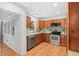 Charming kitchen with stainless steel appliances and warm wood cabinetry at 927 Boardman St, Orlando, FL 32804
