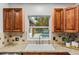 Kitchen sink area with a view of the backyard pool and patio at 927 Boardman St, Orlando, FL 32804