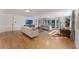 Expansive living room with hardwood floors, natural light, and modern furniture at 927 Boardman St, Orlando, FL 32804