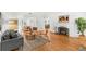 Bright living room with hardwood floors, white walls, fireplace, and natural light, creating a cozy ambiance at 927 Boardman St, Orlando, FL 32804