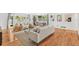 Bright living room showcasing hardwood floors, neutral tones, a comfortable seating area, and backyard views at 927 Boardman St, Orlando, FL 32804