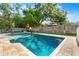 Sparkling pool offering a refreshing retreat in a private backyard with mature trees at 927 Boardman St, Orlando, FL 32804