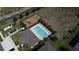 Aerial view featuring a sparkling community pool, lounge area, and playground at 971 Desert Candle Dr, Ocoee, FL 34761
