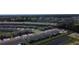 Aerial view of community featuring townhomes, parking, and nearby roadways at 971 Desert Candle Dr, Ocoee, FL 34761