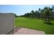 Lovely backyard features a well-manicured lawn, privacy fence, and paved patio at 971 Desert Candle Dr, Ocoee, FL 34761