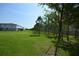 Expansive backyard showing mature landscaping, a well-manicured lawn, and plenty of space at 971 Desert Candle Dr, Ocoee, FL 34761