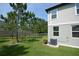 Manicured backyard with privacy fence, lush lawn, and mature landscaping at 971 Desert Candle Dr, Ocoee, FL 34761