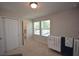 Bedroom featuring a white crib, a view of a bathroom and lots of natural light at 971 Desert Candle Dr, Ocoee, FL 34761