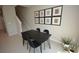 Cozy dining area featuring a black table with seating for four and neutral decor at 971 Desert Candle Dr, Ocoee, FL 34761