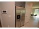 A stainless steel refrigerator is next to the door in the kitchen at 971 Desert Candle Dr, Ocoee, FL 34761