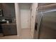A view of the kitchen from the refrigerator looking down the hall at 971 Desert Candle Dr, Ocoee, FL 34761