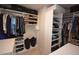 Well-organized walk-in closet featuring custom shelving and hanging rods for optimal storage at 971 Desert Candle Dr, Ocoee, FL 34761