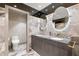 Well-appointed bathroom with double sinks, modern fixtures, and a separate toilet area at 100 S Eola Dr # 1406, Orlando, FL 32801