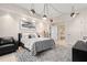 Well-lit bedroom with a comfortable bed, patterned rug, and chic decor, creating a relaxing and inviting atmosphere at 100 S Eola Dr # 1406, Orlando, FL 32801