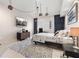 Stylish bedroom with modern furnishings, a wall-mounted TV, and unique pendant lighting, creating a cozy retreat at 100 S Eola Dr # 1406, Orlando, FL 32801