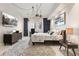 Modern bedroom with a sleek desk area, stylish furnishings, and unique lighting fixtures for a contemporary feel at 100 S Eola Dr # 1406, Orlando, FL 32801