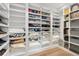 Walk-in closet featuring organized shelves and ample storage for clothes and accessories at 100 S Eola Dr # 1406, Orlando, FL 32801