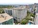 Beautiful exterior shot of a high-rise condominium building with balconies and lush landscaping at 100 S Eola Dr # 1406, Orlando, FL 32801