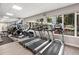 Bright fitness center featuring state-of-the-art treadmills and panoramic windows at 100 S Eola Dr # 1406, Orlando, FL 32801