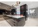 A spacious kitchen with a large island, modern appliances, and elegant decor at 100 S Eola Dr # 1406, Orlando, FL 32801