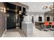 A gourmet kitchen featuring sleek cabinetry, a marble island, and stainless steel appliances at 100 S Eola Dr # 1406, Orlando, FL 32801