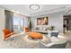 Bright living room featuring modern furniture, a stylish rug, and a cozy ambiance at 100 S Eola Dr # 1406, Orlando, FL 32801