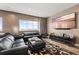 Modern living room boasts stylish furniture, hardwood floors, and large-screen TV at 100 S Eola Dr # 1406, Orlando, FL 32801