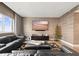 Modern living room with comfortable seating, large-screen TV, and expansive views at 100 S Eola Dr # 1406, Orlando, FL 32801