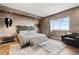 Stylish main bedroom with ample light, modern decor, and hardwood floors at 100 S Eola Dr # 1406, Orlando, FL 32801