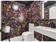 Chic powder room featuring bold floral wallpaper and a modern marble vanity at 100 S Eola Dr # 1406, Orlando, FL 32801