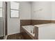 Bathroom showcasing soaking tub with tile surround, glass shower, and window at 10111 Tierra Bella Dr, Orlando, FL 32825