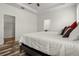 A bright bedroom featuring wood-look flooring and walk in closet at 10111 Tierra Bella Dr, Orlando, FL 32825