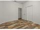 This bedroom features gorgeous multi-tone wood-look flooring and a large closet at 10111 Tierra Bella Dr, Orlando, FL 32825