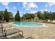 Resort-style community pool and fountain with lounge chairs on a brick patio at 10111 Tierra Bella Dr, Orlando, FL 32825
