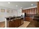 This kitchen boasts stainless steel appliances, granite countertops and mosaic backsplash at 10111 Tierra Bella Dr, Orlando, FL 32825