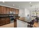 Well-equipped kitchen featuring stainless steel appliances, granite countertops, and a breakfast bar with seating at 10111 Tierra Bella Dr, Orlando, FL 32825