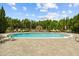 Community pool featuring a fountain and ample lounge seating at 10111 Tierra Bella Dr, Orlando, FL 32825