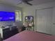 Cozy bedroom with a vanity and storage, featuring a window and closet at 10148 Malpas Pt, Orlando, FL 32832