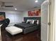 Modern bedroom featuring a platform bed, dark hardwood floors, and sleek contemporary furnishings at 10148 Malpas Pt, Orlando, FL 32832