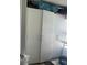 Ample storage space featuring tall, white closets in an organized area, perfect for household supplies at 10148 Malpas Pt, Orlando, FL 32832
