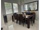 Elegant dining room featuring a large table, modern decor, and ample natural light at 10148 Malpas Pt, Orlando, FL 32832