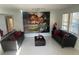 Stylish living space with modern decor, featuring unique artwork and comfortable seating at 10148 Malpas Pt, Orlando, FL 32832