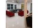Spacious living room featuring plush seating, bright windows, and modern decor at 10148 Malpas Pt, Orlando, FL 32832